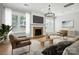 Bright living room with stone fireplace, modern lighting, and neutral decor at 809 Ayrshire Ave, Fort Mill, SC 29708