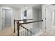 View of the staircase with wood railing and white risers at 809 Ayrshire Ave, Fort Mill, SC 29708