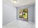 Light and airy bedroom with marble floors and sliding glass doors to the backyard at 814 W Gold St, Kings Mountain, NC 28086