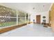 Covered carport with lattice details, offering a sheltered space with a glimpse of the outdoors and easy access to the home at 814 W Gold St, Kings Mountain, NC 28086