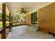Covered brick porch with ceiling fan and sliding glass door to the home's interior at 814 W Gold St, Kings Mountain, NC 28086