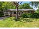 Charming brick home with mature trees and a welcoming, covered carport, offering both curb appeal and practical convenience at 814 W Gold St, Kings Mountain, NC 28086