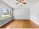 Spacious living room with gleaming hardwood floors, a large window, and neutral paint, perfect for relaxing or entertaining at 814 W Gold St, Kings Mountain, NC 28086