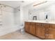 The bathroom has a shower-tub combo with a double sink vanity and a large mirror at 9720 Walkers Glen Nw Dr, Concord, NC 28027