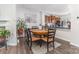 Charming dining area adjoining the kitchen, complete with a round table and stylish decor at 9720 Walkers Glen Nw Dr, Concord, NC 28027