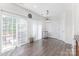 Bright dining area featuring a mini-fridge, sliding glass doors, and wood-look floors at 9720 Walkers Glen Nw Dr, Concord, NC 28027