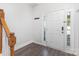 Inviting entryway showcasing a bright front door with side lights and hardwood floors at 9720 Walkers Glen Nw Dr, Concord, NC 28027