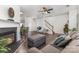 Bright and airy living room showcasing a fireplace, plush seating, and access to other living spaces at 9720 Walkers Glen Nw Dr, Concord, NC 28027