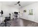 Office space features wood-look flooring and multiple desks for versatile use at 9720 Walkers Glen Nw Dr, Concord, NC 28027