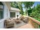 Relaxing back deck featuring comfortable seating and views of the lush backyard, perfect for outdoor entertaining at 975 Pine Knoll Rd, Fort Mill, SC 29715
