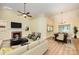Open-concept living and dining area with fireplace, vaulted ceiling, hardwood floors, and a seamless flow for entertaining at 975 Pine Knoll Rd, Fort Mill, SC 29715