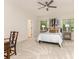 Neutral bedroom with windows, ceiling fan, and a decorative desk at 10333 Scott Gate Ct, Charlotte, NC 28277