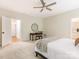 Bedroom with ceiling fan, carpet, a writing desk, and lots of natural light at 10333 Scott Gate Ct, Charlotte, NC 28277