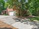 Traditional brick home with a two car garage and mature landscaping at 10333 Scott Gate Ct, Charlotte, NC 28277