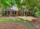 Charming two-story brick home with a well-maintained lawn and mature trees at 10333 Scott Gate Ct, Charlotte, NC 28277