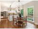 Bright eat-in kitchen with stainless steel appliances, white cabinets, and natural light at 10333 Scott Gate Ct, Charlotte, NC 28277