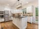 Modern kitchen featuring granite countertops, stainless steel appliances, and a center island at 10333 Scott Gate Ct, Charlotte, NC 28277