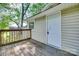 Back porch with wooden decking and railing overlooking backyard at 104 W Maryland Ave, Bessemer City, NC 28016
