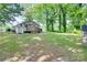 View of the back of the home with a deck overlooking the yard at 104 W Maryland Ave, Bessemer City, NC 28016