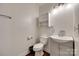 Cozy bathroom featuring a toilet, sink, vanity, and mirrored cabinet at 104 W Maryland Ave, Bessemer City, NC 28016