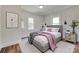 Cozy bedroom featuring natural light from dual windows and complemented by stylish decor at 104 W Maryland Ave, Bessemer City, NC 28016