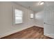Bright bedroom with hardwood flooring, white trim and natural light from a window at 104 W Maryland Ave, Bessemer City, NC 28016