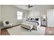 Bright bedroom with large bed, stylish decor and a lot of natural light at 104 W Maryland Ave, Bessemer City, NC 28016