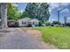 Charming one-story home with covered parking and a well-manicured lawn at 104 W Maryland Ave, Bessemer City, NC 28016