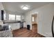 Bright kitchen features granite counters, stainless steel appliances, and stylish wood flooring at 104 W Maryland Ave, Bessemer City, NC 28016