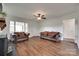 Comfortable living room with fireplace, wood floors, and windows at 104 W Maryland Ave, Bessemer City, NC 28016