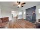 Cozy living room with a brick fireplace, wood floors, and neutral decor at 104 W Maryland Ave, Bessemer City, NC 28016