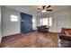 Bright living room with a fireplace, wood floors, and ample natural light at 104 W Maryland Ave, Bessemer City, NC 28016