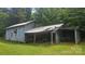 Detailed image of a weathered barn reveals its unique architectural details and hints at its rich history at 11056 Us Highway 52 N Hwy, Wadesboro, NC 28170