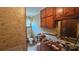 Bathroom with patterned wallpaper, toilet, and wooden cabinets at 11056 Us Highway 52 N Hwy, Wadesboro, NC 28170