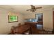 Cozy dining area featuring a wooden table, chairs, and view into the kitchen at 11056 Us Highway 52 N Hwy, Wadesboro, NC 28170