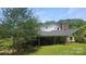 Rear exterior of a charming residence boasting an inviting covered patio and sprawling green space at 11056 Us Highway 52 N Hwy, Wadesboro, NC 28170