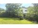 Charming two-story home with brick and white exterior, front porch, and covered in trees at 11056 Us Highway 52 N Hwy, Wadesboro, NC 28170