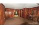 Living Room with paneled walls and view to front room and desk on the right at 11056 Us Highway 52 N Hwy, Wadesboro, NC 28170