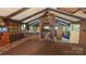 Rustic living room with a brick fireplace and wood-beamed ceiling exudes warmth and character at 11056 Us Highway 52 N Hwy, Wadesboro, NC 28170