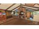 Rustic living room with a brick fireplace and wood-beamed ceiling exudes warmth and character at 11056 Us Highway 52 N Hwy, Wadesboro, NC 28170