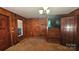 Spacious living room with wood paneling and carpeted floors at 11056 Us Highway 52 N Hwy, Wadesboro, NC 28170