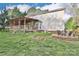 Large backyard featuring a deck, a fire pit, and a sandbox at 111 Painted Bunting Dr, Troutman, NC 28166