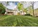 Spacious backyard with a covered deck and mature trees, offering ample outdoor space at 111 Painted Bunting Dr, Troutman, NC 28166