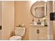 Bathroom with white vanity, round mirror, and decor at 111 Painted Bunting Dr, Troutman, NC 28166