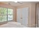 Bright bedroom with large window and closet at 111 Painted Bunting Dr, Troutman, NC 28166