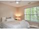 Cozy bedroom with a large window bringing in natural light at 111 Painted Bunting Dr, Troutman, NC 28166