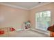 Bright bedroom features plush carpet, neutral walls, and window at 111 Painted Bunting Dr, Troutman, NC 28166