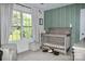 Bright Bedroom with a large window and a plush teddy bear at 111 Painted Bunting Dr, Troutman, NC 28166