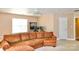 This spacious bonus room features a comfortable sectional and a desk with computer monitors at 111 Painted Bunting Dr, Troutman, NC 28166