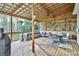 Large covered deck with a ceiling fan, outdoor seating, and a view of the backyard at 111 Painted Bunting Dr, Troutman, NC 28166
